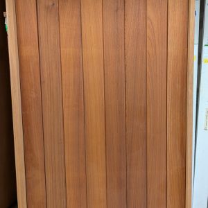 Vertical plank pivot door entry