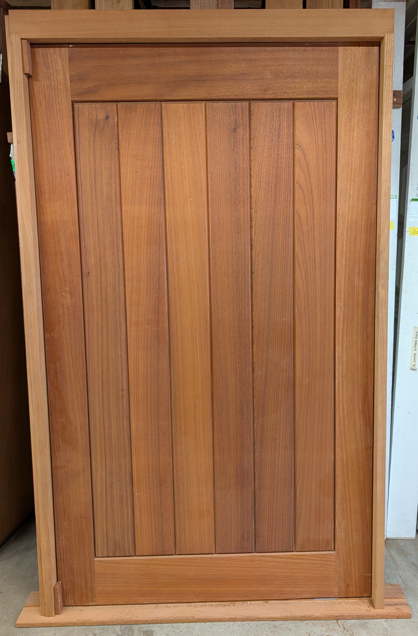 Vertical plank pivot door entry