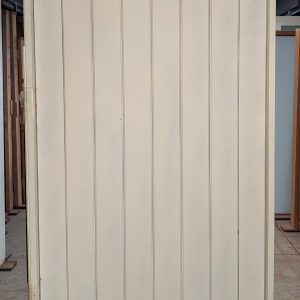 Vertical plank pivot door entry